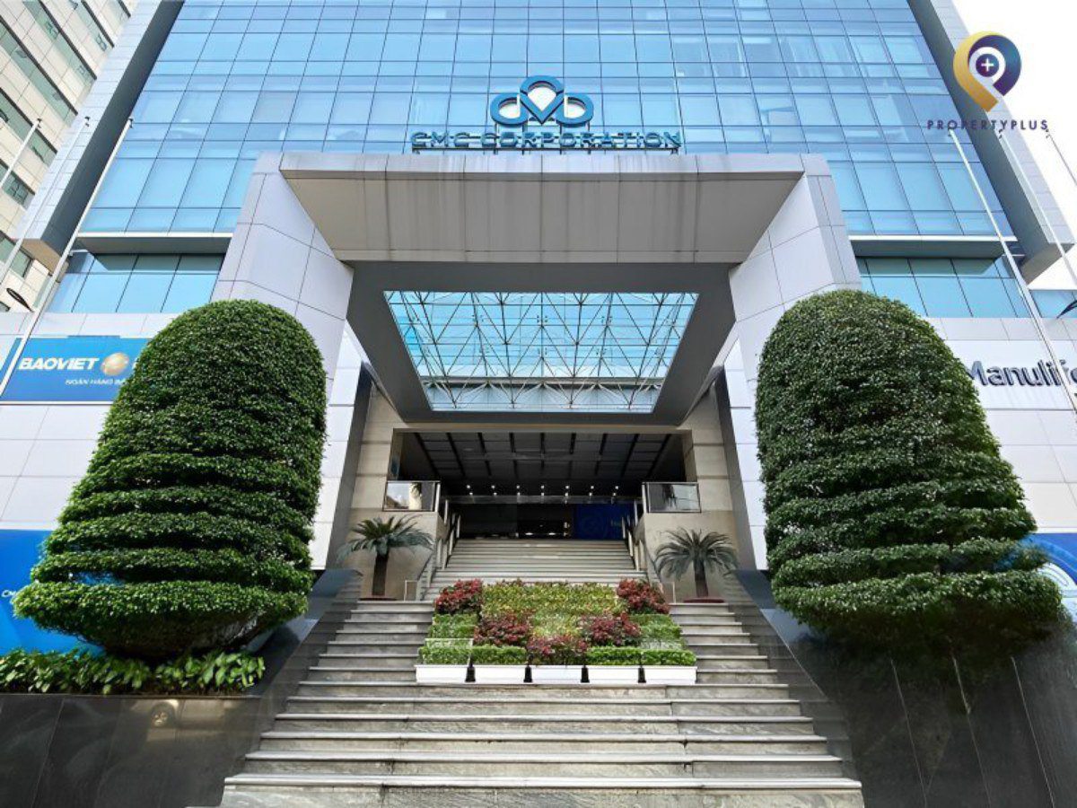 Entrance lobby of CMC Tower with modern glass facade and landscaped stairs